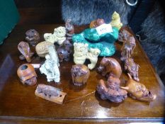 A collection of carved Netskis, hardstone, bone and wood examples and a picture