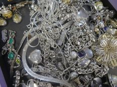 A tray of modern silver jewellery including neck chains, earrings, brooches, etc