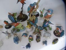 A quantity of model birds, mainly Kingfishers, including country artists examples