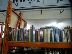 Shelf of various hardback and other books