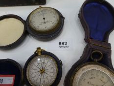 Leather cased compass and two pocket weather gauges, one by T B Winter