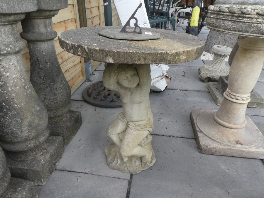 Stone effect sundial with a plinth depicting a child
