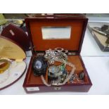 A jewellery box containing white metal bracelets, bead necklaces, pendants, brooches etc