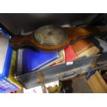 Vintage suitcase containing old books, barometer etc