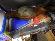 Vintage suitcase containing old books, barometer etc