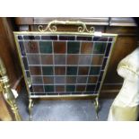 Antique brass framed fire screen inset with glass panels