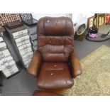 Brown leather "Stress less" revolving arm chair and footstool