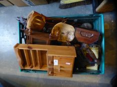 A crate of collectables including apprentice's wooden model of a dresser, carved treen, iron etc