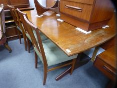 A mid century teak rectangular extending table and a set of four dining chairs possibly G plan