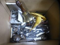 A box to include Clocks, cutlery, plated ware, brass bell, wooden candle holders etc,