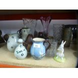 A collection of glass vases, studio pottery, hangman glass, Winnie the Pooh Royal Doulton model etc