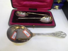 A mixed lot comprising of two silver spoons hallmarked Sheffield 1911, a silver matchbox case, decor