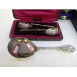 A mixed lot comprising of two silver spoons hallmarked Sheffield 1911, a silver matchbox case, decor