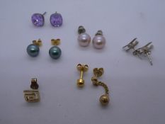 Pair of silver bi plane earrings and other gold and other metal earrings. Some marked 750