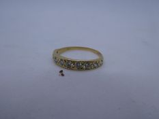 18ct yellow gold band ring set with 9 diamonds, marks worn, size P, 2.2g