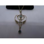 9ct yellow gold chain hung with a delicate pendant with aquamarine and seed pearl marked '9ct', pend