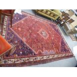 An Afghan rug having central diamond with floral design, 305 x 229 cms