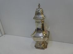 A decorative Sugar Sifter hallmarked London 1919 Edward Barnard & Sons Ltd, decorative foot, weight