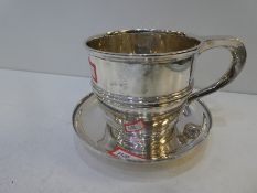 A silver heavy cup with a silver coaster.  High quality cup hallmarked Exeter 1911 John Cochloun Sil