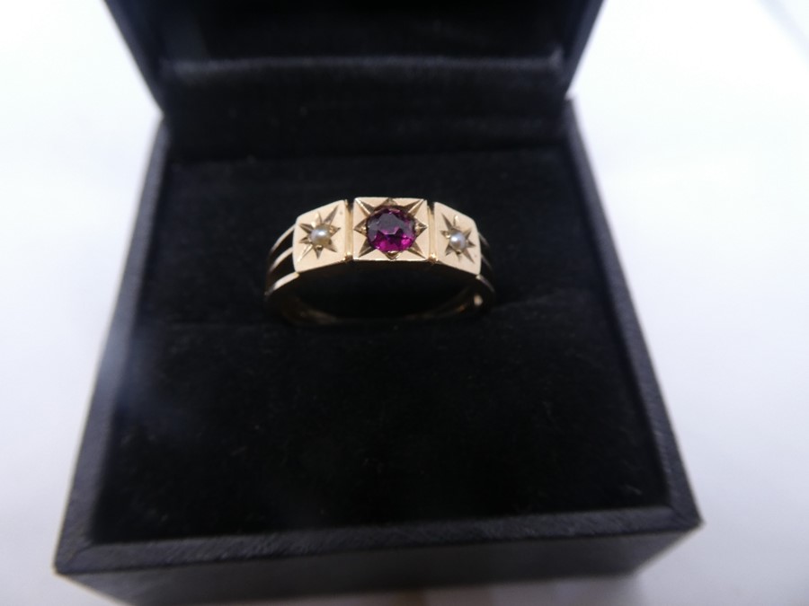 Unmarked rose gold gypsy ring with central garnet and 2 seed pearls, size S, approx 2.5g