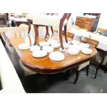 An antique French walnut extending dining table having two leaves, 244 cms, and a set of six barback