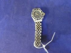 A vintage Tag Heuer watch stainless steel bracelet with gold plated center links AF