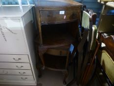 A pair of dark wood bedside tables, two chairs and a folding example