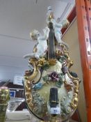 Large piece of Capodimonte depicting cherubs and violins