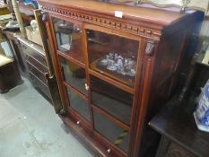 Mahogany glazed two door bookcase with 2 base drawers