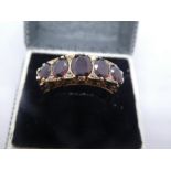 9ct yellow gold Victorian dress ring set with diamond chips and graduated garnets, marked 375, gross
