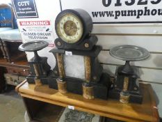 Antique slate and marble case mantle clock with brass and enamel dial, with matching plinths