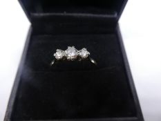 Yellow gold and platinum diamond trilogy ring, marked 'PLAT' size T, central diamond approx 0.5 CARA