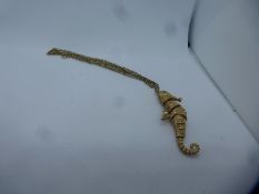 9ct yellow gold articulated seahorse pendant marked 375, 6cm, hung on 9ct fine yellow gold belcher c