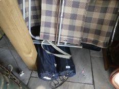 Two camping tables in bags and two chairs