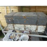 Two wooden storage trunks