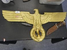 Cast metal emblem of the German Imperial Eagle sign, a badge and a dagger