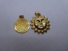 18ct yellow gold pendant in the form of the sun and another circular example, both marked 750, appro