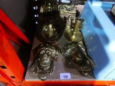 A selection of brass door knockers to incl. different designs incl. female faces etc