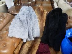 A bag of fur coats and similar