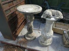 Stone effect bird bath of a boy and a stone effect plinth and a dog