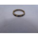 Yellow metal band ring inset sapphire and clear stones, size N, approx 2g