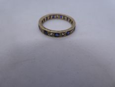 Yellow metal band ring inset sapphire and clear stones, size N, approx 2g