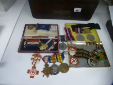 WWI trio of medals, Red Cross badges and sundry