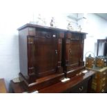 A pair of reproduction mahogany bedside cupboards having one drawer to each