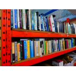 A shelf and a half of fishing related hardback books