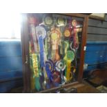 Antique mahogany glazed display case containing dog show rosettes, and a corner wot not