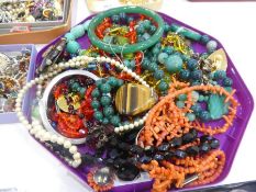 Collection of various hardstone necklaces, bracelets, bangles, etc to include jade, coral, jet, tige