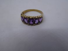 9K yellow gold amethyst and diamond ring with a row of graduated stones, marked 9K, size P, 3g