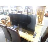 A JVC 40 inch flat screen TV with remote