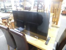 A JVC 40 inch flat screen TV with remote